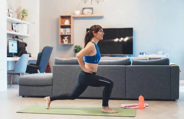 Photo of Woman exercising at home