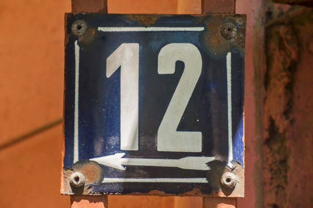 istock Weathered enameled plate number 12 1056005210