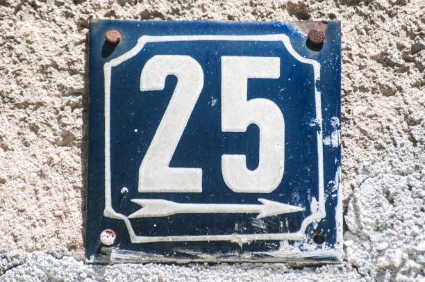 istock Weathered enameled plate number 25 1056005224