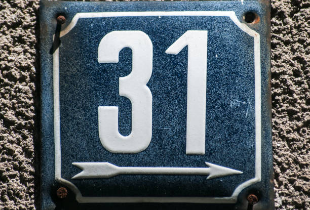 istock Weathered enameled plate number 31 1056005780