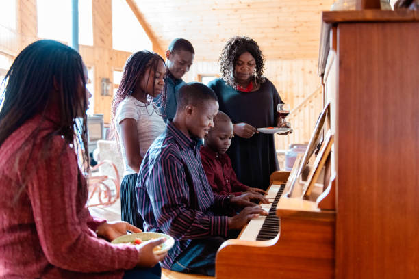 istock Thanksgiving dinner with American-African family preparing dinner 1056007716