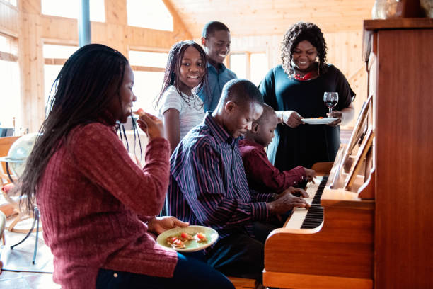 istock Thanksgiving dinner with American-African family preparing dinner 1056007786