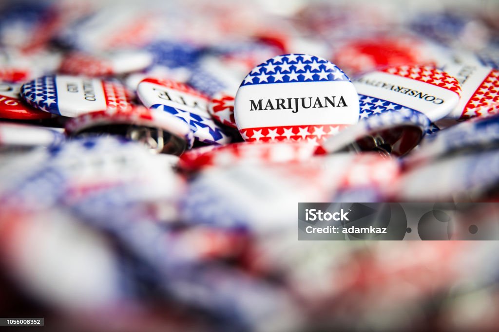 Election Vote Buttons - Marijuana Closeup of election vote button with text that says Marijuana Cannabis Plant Stock Photo