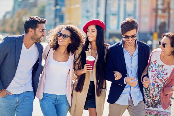 istock Happy friends are hugging and walking together 1056009456