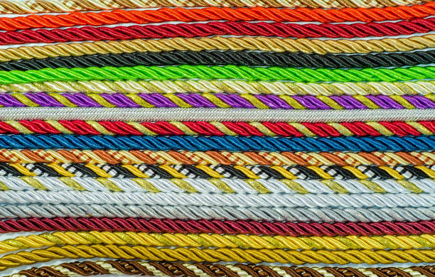 istock Multicolored ropes laid nearby, colored background, textiles 1056011886