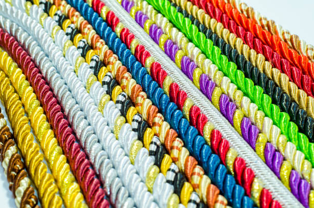 istock Multicolored ropes laid nearby, colored background, textiles 1056011898