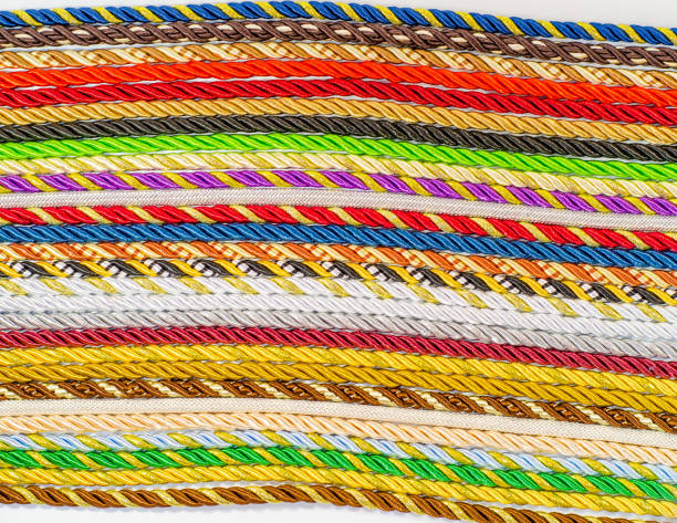 istock Multicolored ropes laid nearby, colored background, textiles 1056011918