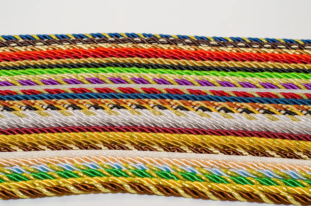 istock Multicolored ropes laid nearby, colored background, textiles 1056011958