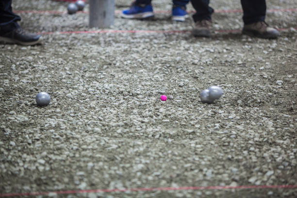istock Metallic petanque ball in action 1056012166