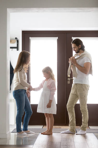 istock Family standing in hallway and gathering for a walk 1056019014