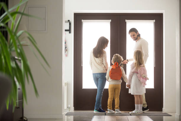 istock Couple with children in hallway gather for a walk 1056019020