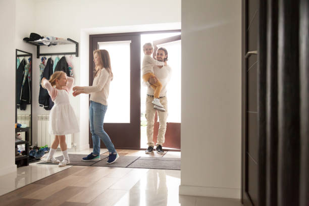 istock Couple with children in hallway gather for a walk 1056019032