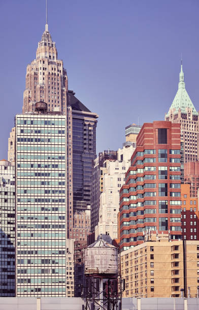istock Water tank among modern buildings in Manhattan, NYC. 1056024084