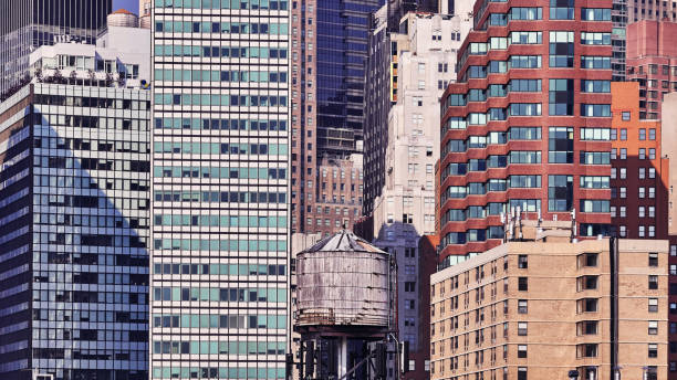 Water tank among modern buildings in Manhattan, NYC.