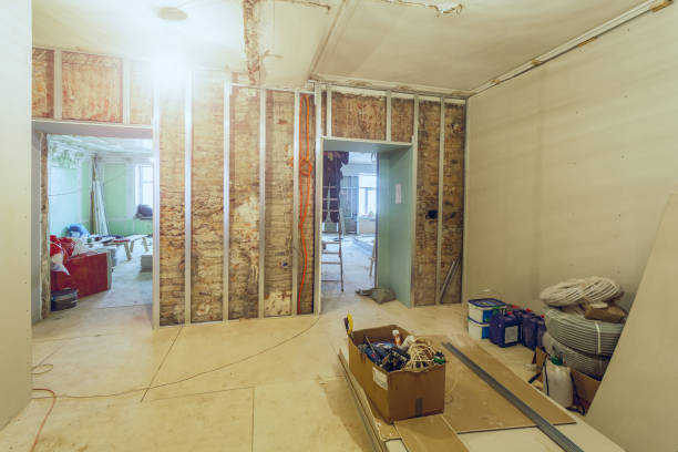 istock Working process of installing metal frames for plasterboard - drywall - for making gypsum walls  in apartment with construction materials that is under construction, overhaul, remodeling, renovation, extension, restoration and reconstruction 1056026680