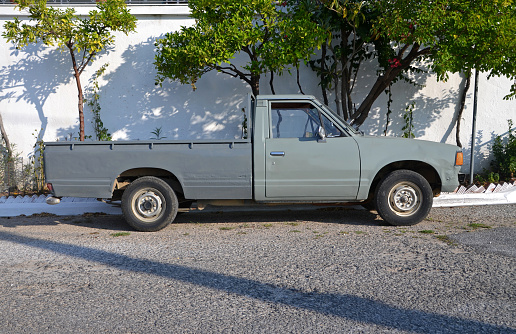Side view on the classic pick-up vehicle on the street.