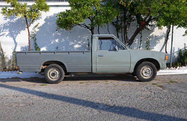 old pick-up vehicle on the street - truck pick up truck side view car imagens e fotografias de stock