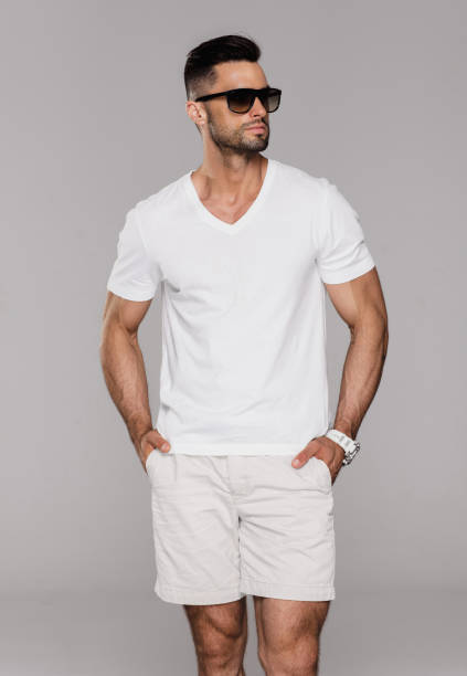 istock Handsome man in white summer clothes wear sunglasses 1056033362