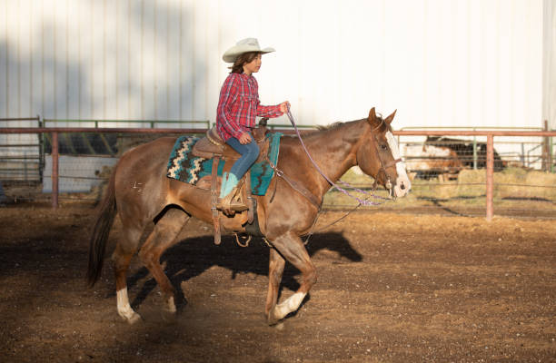 istock Cowgirl riding her horse 1056033414