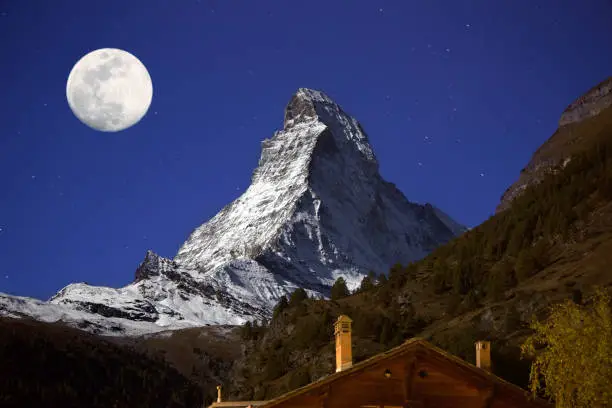 Photo of Big moon over the Matterhorn peak, Zermatt, Switzerland