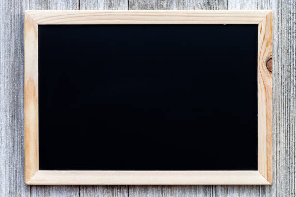 istock Mock up with black chalkboard on wooden rustic background 1056037264