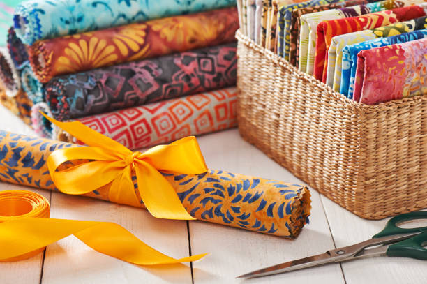 istock Batik kits turned into rolls tied with a decorative bow 1056038224
