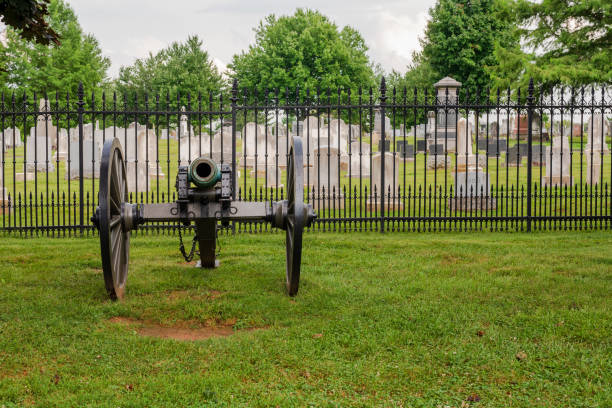 Cannon Outside Cemetery Gates A cannon is displayed outside the gates of the Gettysburg National Military Park. gettysburg national cemetery stock pictures, royalty-free photos & images