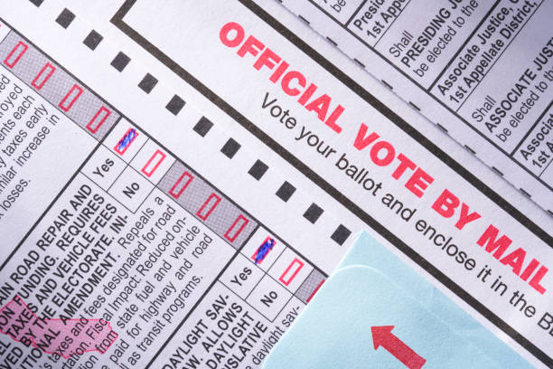 Voting ballot: Absentee voting by mail with candidates and measures Voting ballot: Absentee voting by mail with candidates and measures on paper and pen with glasses absentee ballot photos stock pictures, royalty-free photos & images