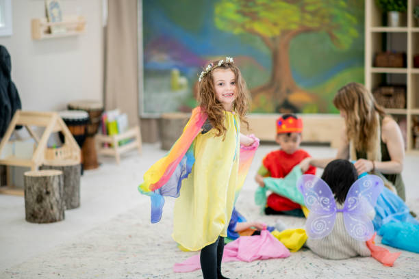 istock Waldorf elementary kids trying on costumes and dancing 1056045292