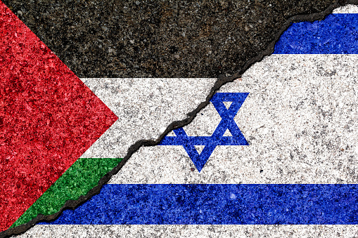 Flags of Israel and Palestine painted on cracked wall background/Israel - Palestinian conflict concept