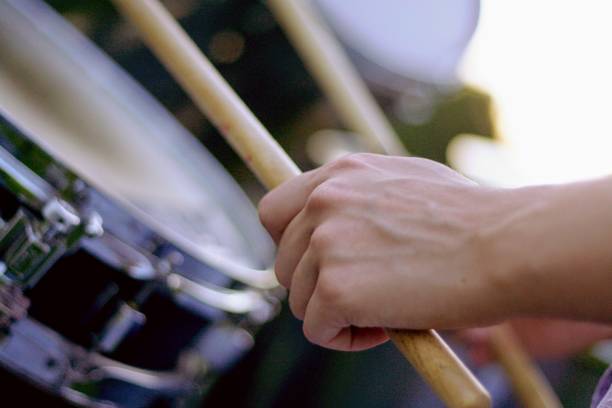 Girl playing drum close up of girl's hands playing snare drum rock group photos stock pictures, royalty-free photos & images