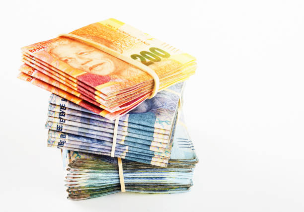 istock Stacked and bundled mixed South African banknotes 1056052980