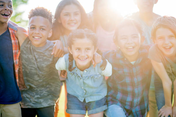 istock Group of kids pose together for a picture 1056054816