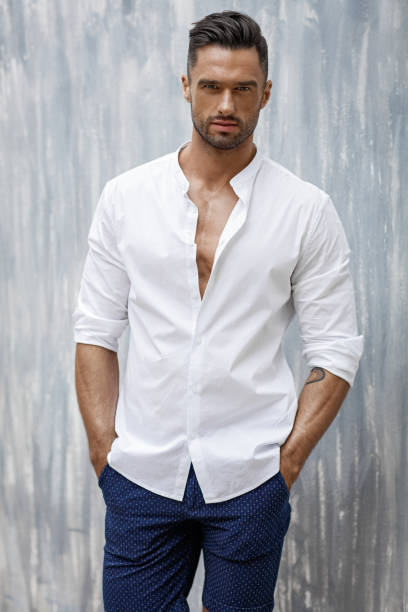 Handsome man wear white shirt and shorts Portrait of handsome man in white shirt sex symbol stock pictures, royalty-free photos & images