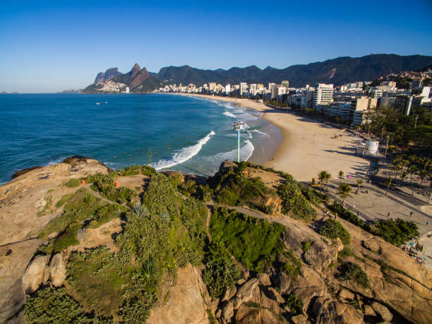 istock Scenic panoramic view of Ipanema Beach from the rocks at Arpoador with Rio de Janeiro skyline. 1056055764