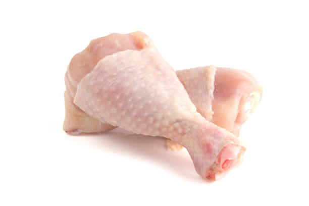 istock Two chicken legs close-up. Raw chicken legs isolated on white background. 1056059434