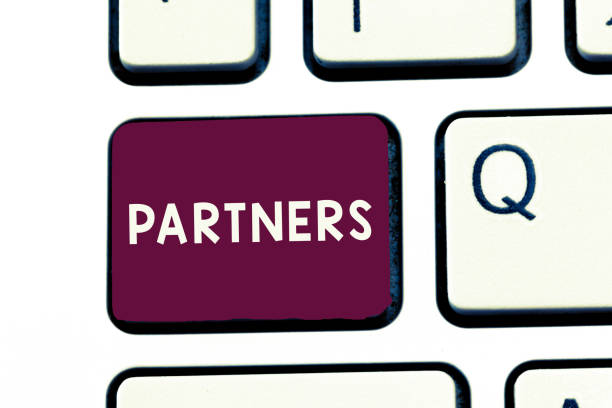 istock Handwriting text writing Partners. Concept meaning demonstrating who takes part undertaking another especially business 1056061562