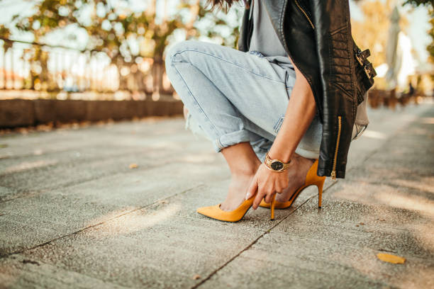 istock Young pretty fashioned girl. New Shoes Problems 1056061910