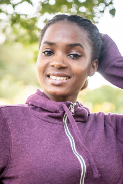 istock Smiling beautiful young black woman 1056063576