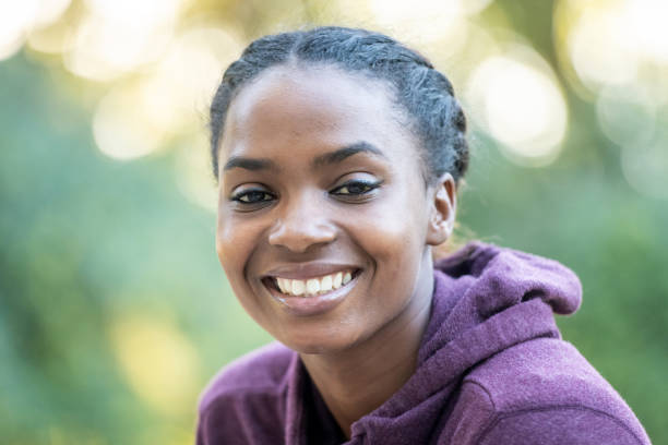 istock Smiling beautiful young black woman 1056063654