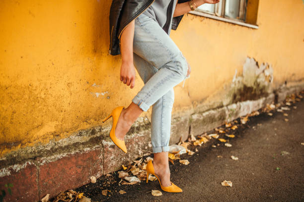 istock Young pretty fashioned girl. New Shoes Problems 1056064026