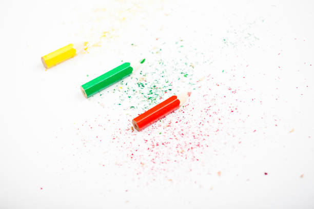 istock Three small pencil red green yellow white background 1056064210