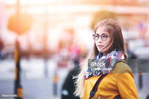 Traveler Young Woman Walking On The Street And Taking Pictures Stock Photo - Download Image Now