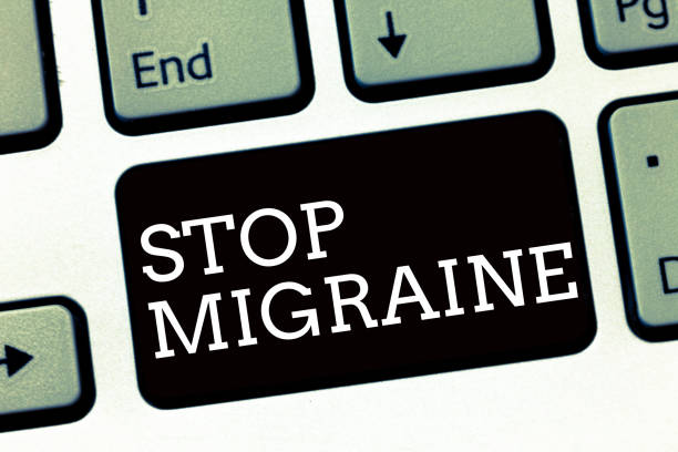 istock Handwriting text writing Stop Migraine. Concept meaning Preventing the full attack of headache Caffeine withdrawal 1056072230