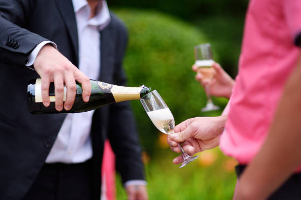 istock Pouring champagne into a glass 1056073898