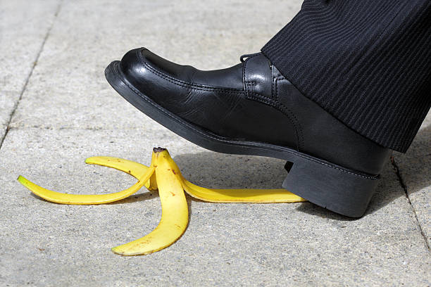 istock Man about to step on a banana peel on the sidewalk 105607650
