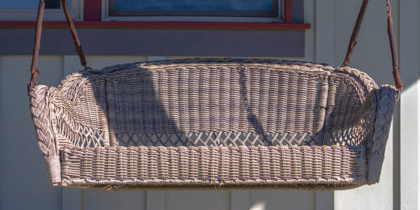 istock Front porch with a swing on a sunny day 1056085914