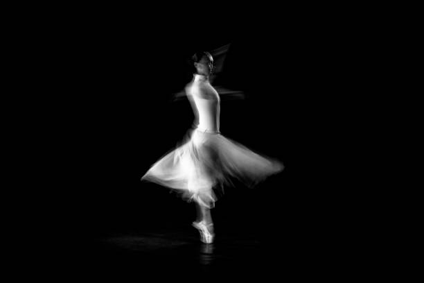 classical dancer dancing on the lack background with white dressed - visual art fotos imagens e fotografias de stock