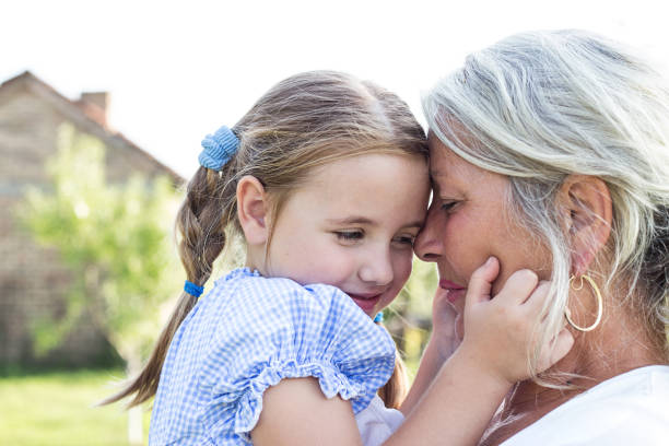 Grandmother and granddaughter stock photo