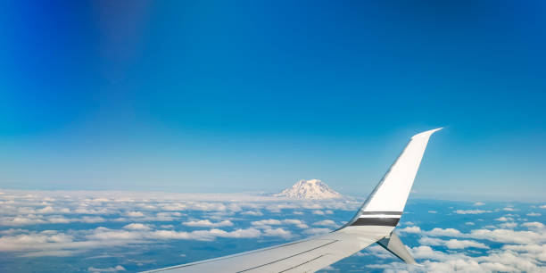 istock Mount Rainier's glacial crest rising above clouds 1056101646
